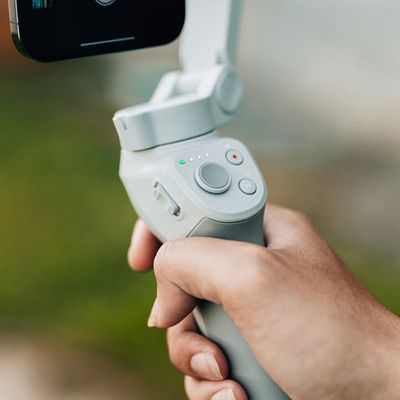 Close-up on a man's hands gripping the floor for stability.