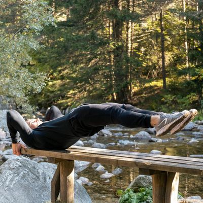 Man doing a controlled bodyweight squat.